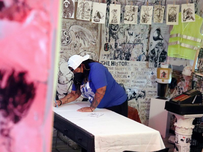 Members of the Southern Illinois University Young Democratic Socialists of America and other organizers make abortion rights protest signs and banners at the Born Again Labor Museam in Carbondale, Illinois, in May 2022.