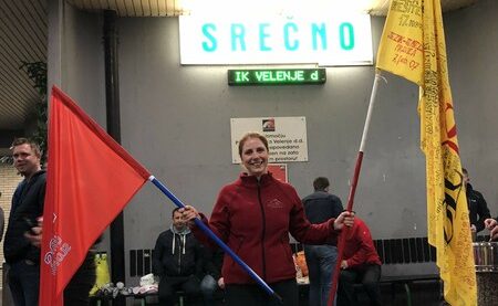 Photo of Slovenian lawyer and trade union leader Ana Jakopič holding union flags in support of striking miners at the Valenje mine in March, 2014. Photo courtesy of Ana Jakopič.