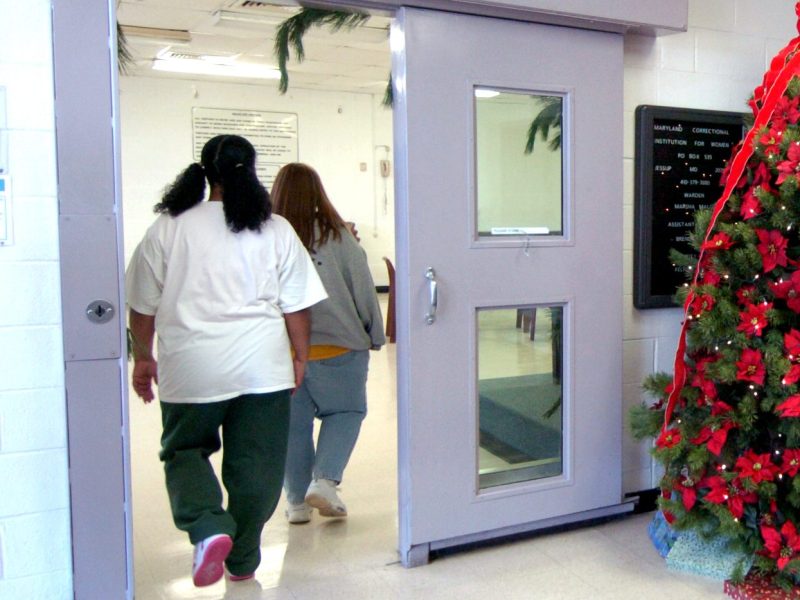 Sabrina Smith and Lori Gipe head to the visitors area at the Maryland Correctional Institution in Jessup