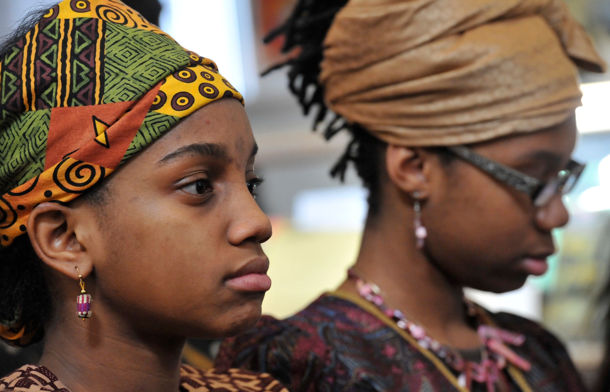 Jocelyn Green (Left) and Shania Alford (Right) listened during the annual Kwanzaa Celebration at the Benjamin Banneker Historical Park and Museum on Dec. 28 in Catonsville, Maryland. The program in it's eighth year celebrates the seven principles of Kwanzaa with performances by the Baltimore County Chapter of Jack and Jill America and the Growing Griots, a youth storytelling program affiliated with the Griots' Circle of Maryland.