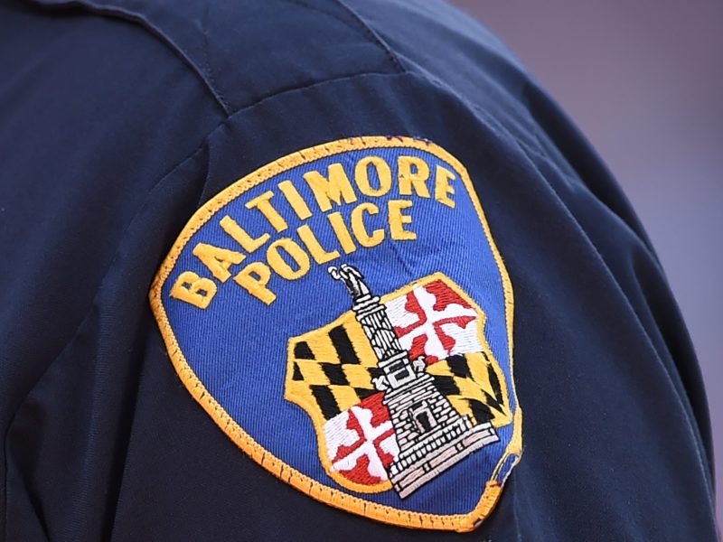 A Baltimore City police emblem on a shirt.