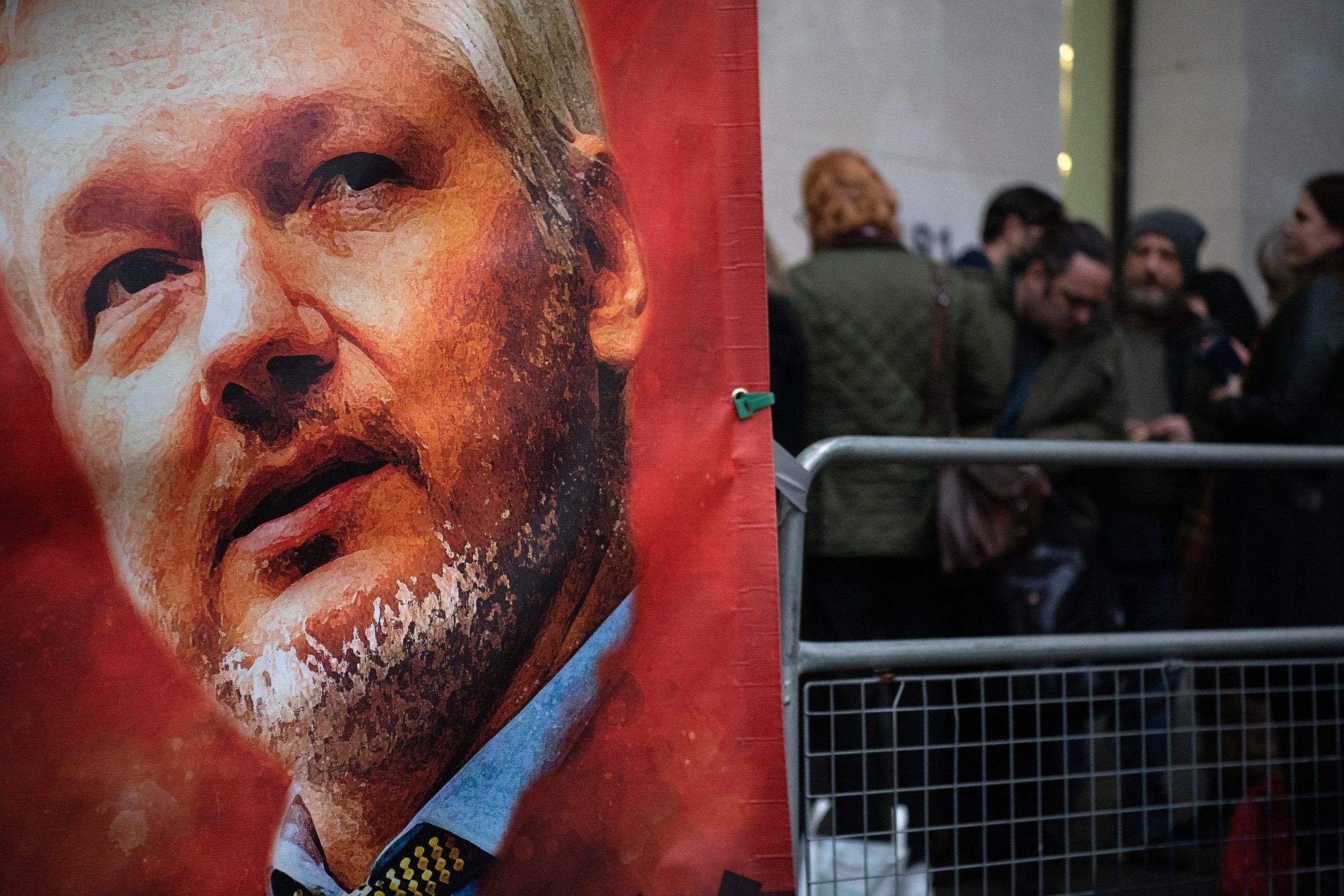 A sign placed by supporters of Wikileaks founder Julian Assange is seen as people wait in line at The City of Westminster Magistrates Court on January 23, 2020, in London, England.