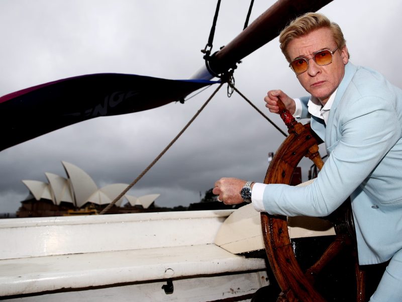 Actor and comedian Rhys Darby poses on a tall ship outside the Park Hyatt during the Australian launch of the new comedy series "Our Flag Means Death" on March 1, 2022, in Sydney, Australia.