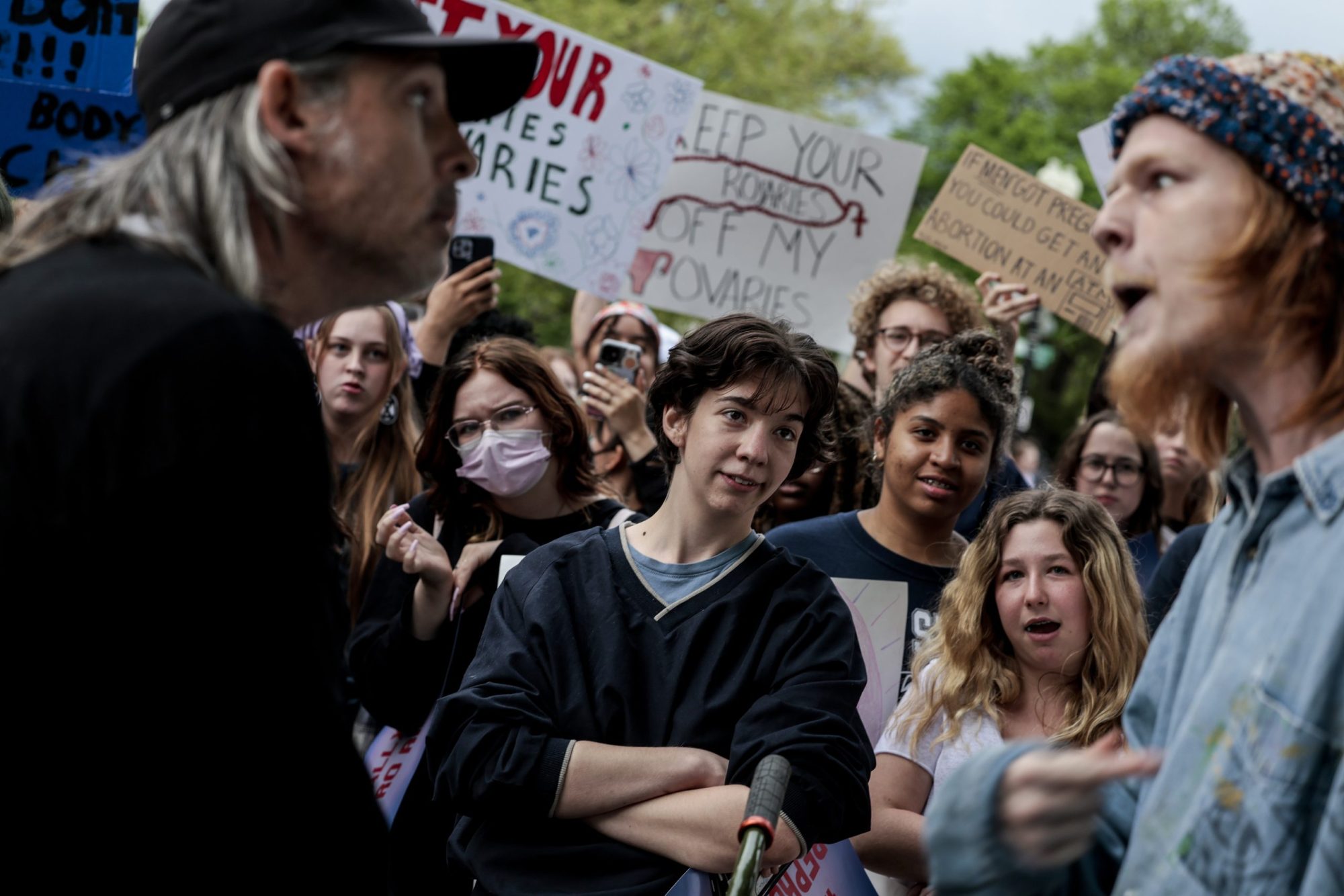 Two men arguing in a protest.