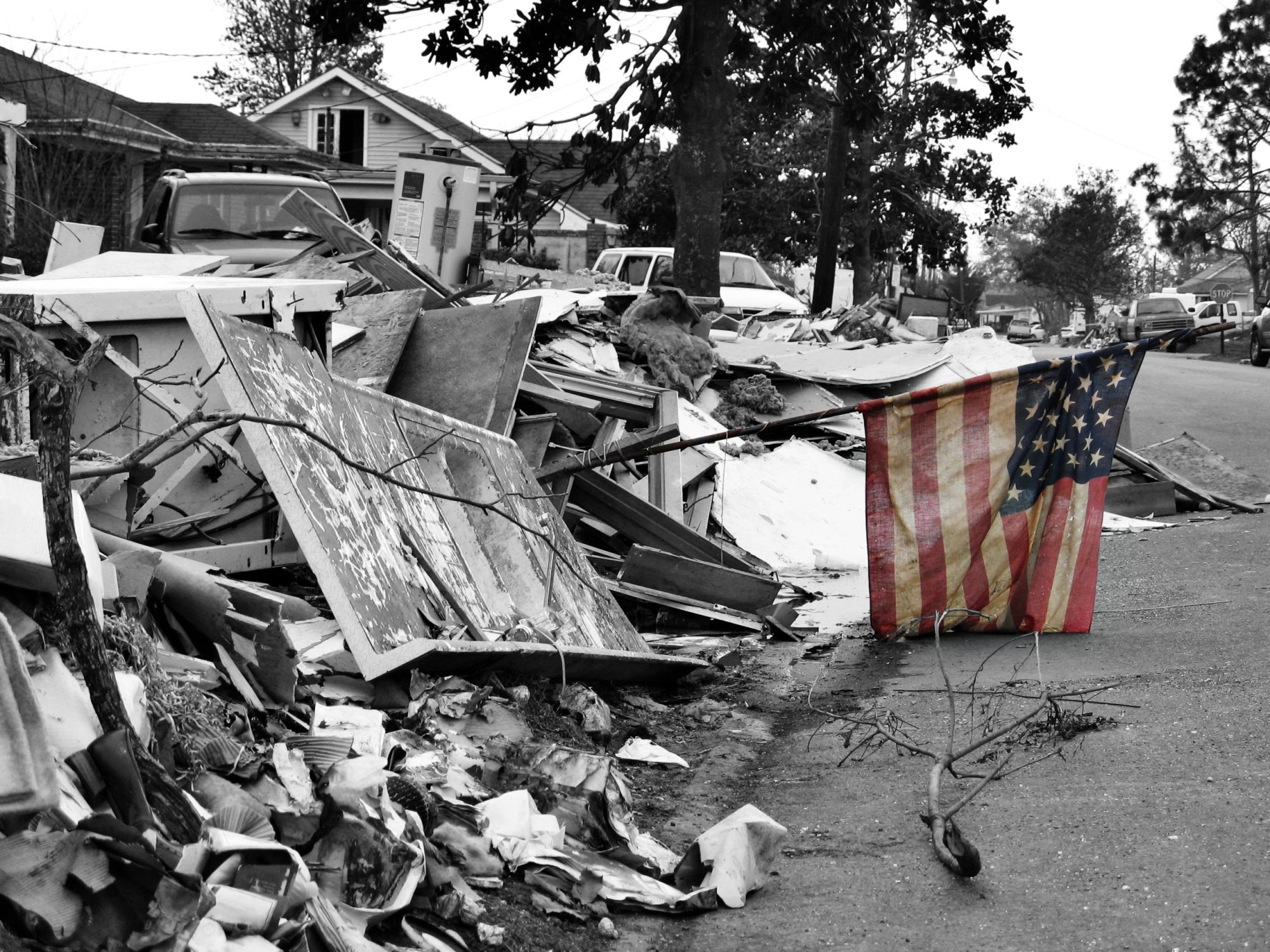 a small sign of hope - a mud-stained and tattered American flag stands in a pile of debris left by Hurricane Katrina in Chalmette, Louisiana
