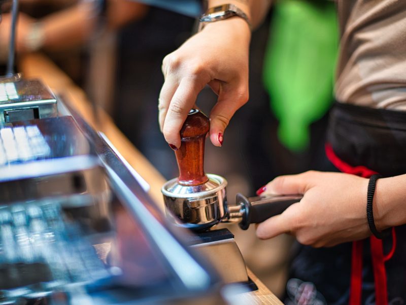 Stock photo of a barista preparing coffee.