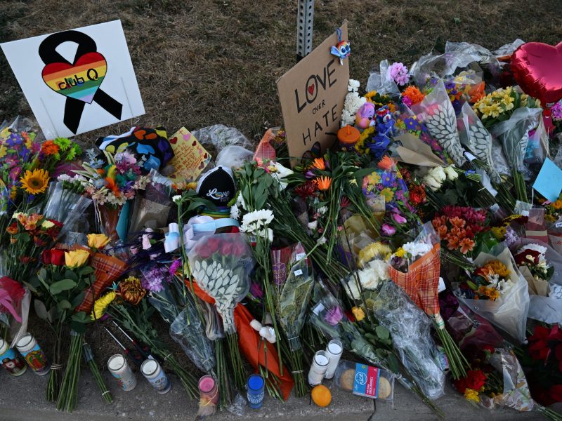 Flowers, signs, balloons and more are left at a makeshift memorial near Club Q on November 20, 2022 in Colorado Springs, Colorado.