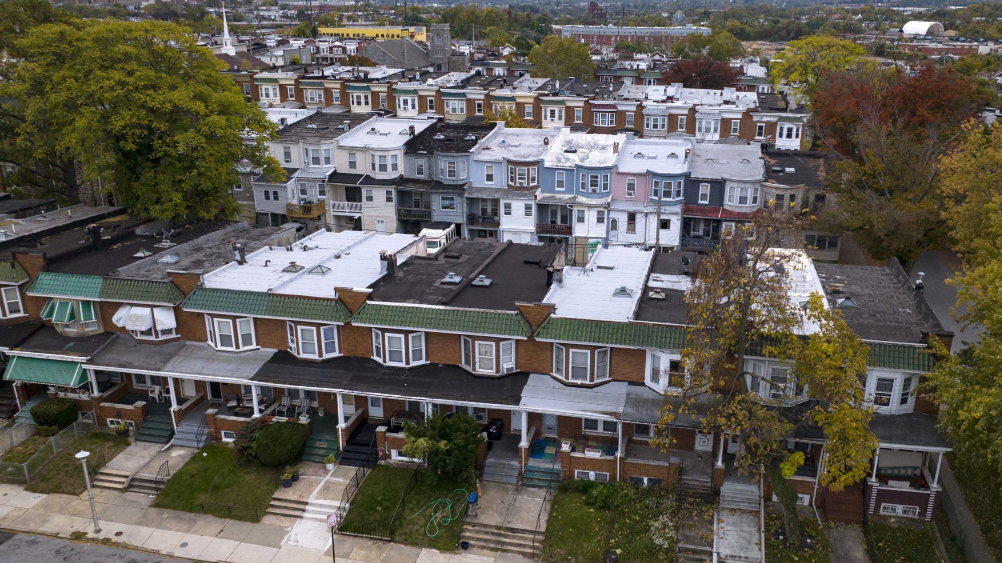 Aerial view of rows of brightly covered row houses of Northern Baltimore. Photo by: Visions of America/Joseph Sohm/Universal Images Group via Getty Images.