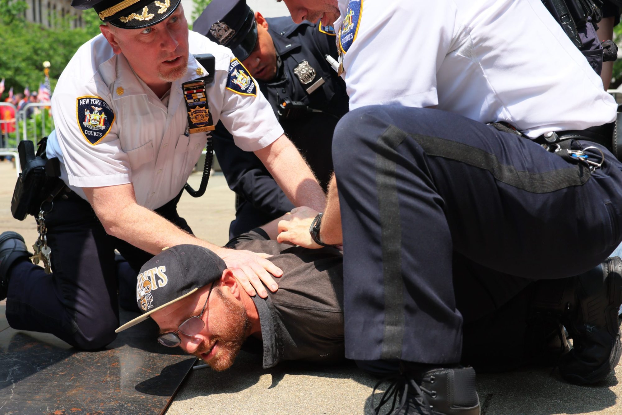 A supporter of Jordan Neely is arrested by NYPD officers during a rally in support of Daniel Penny at Collect Pond Park on May 24, 2023 in New York City. Photo by Michael M. Santiago/Getty Images