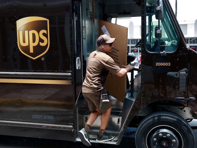 A UPS driver makes a delivery on June 30, 2023 in Miami, Florida. Photo by Joe Raedle/Getty Images
