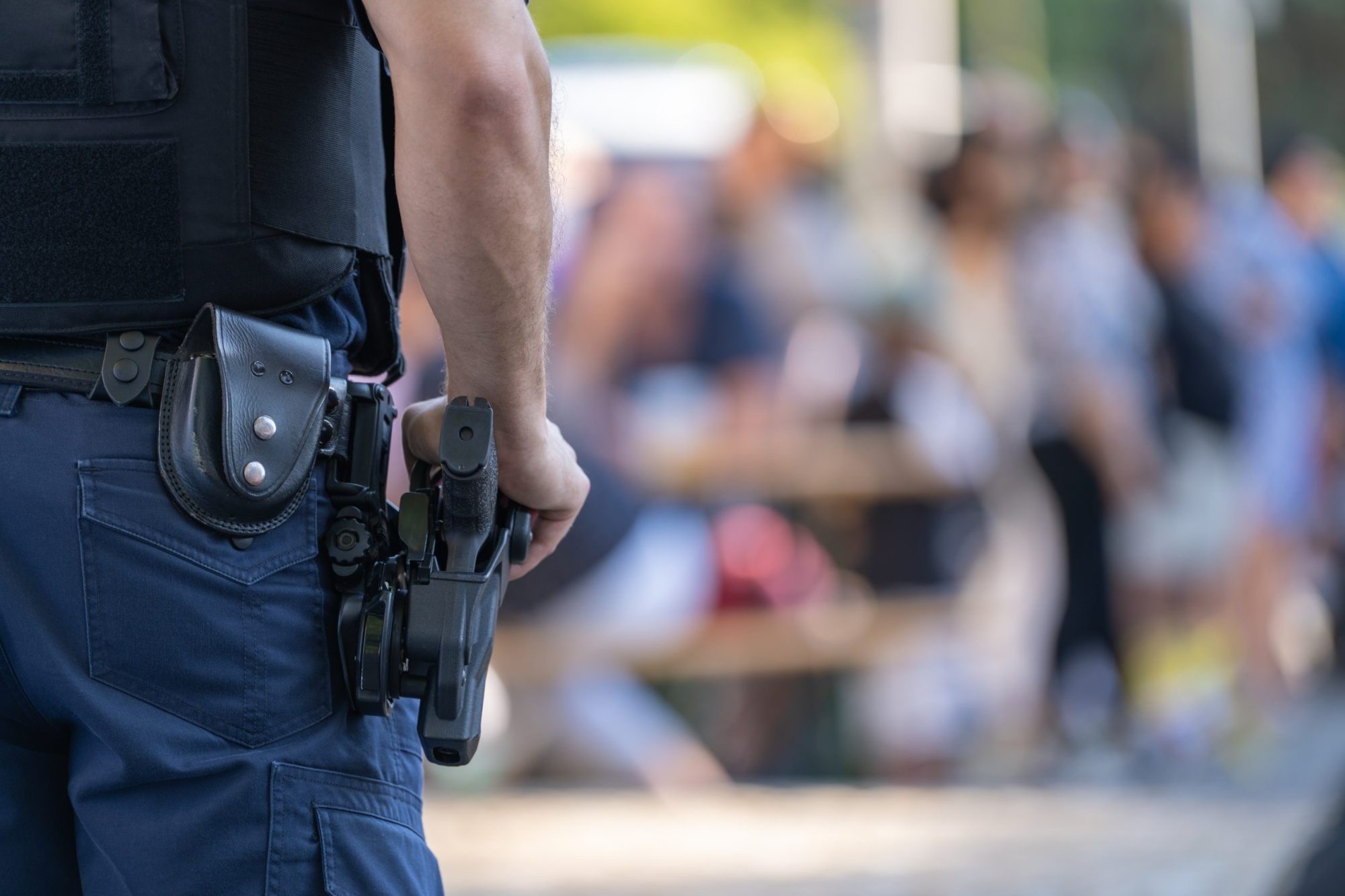 Police officer with weapon stock photo via Getty Images