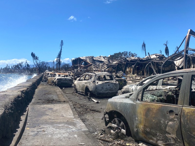 Burned cars and destroyed buildings are pictured in the aftermath of a wildfire in Lahaina, western Maui, Hawaii on August 11, 2023. Photo by PAULA RAMON/AFP via Getty Images
