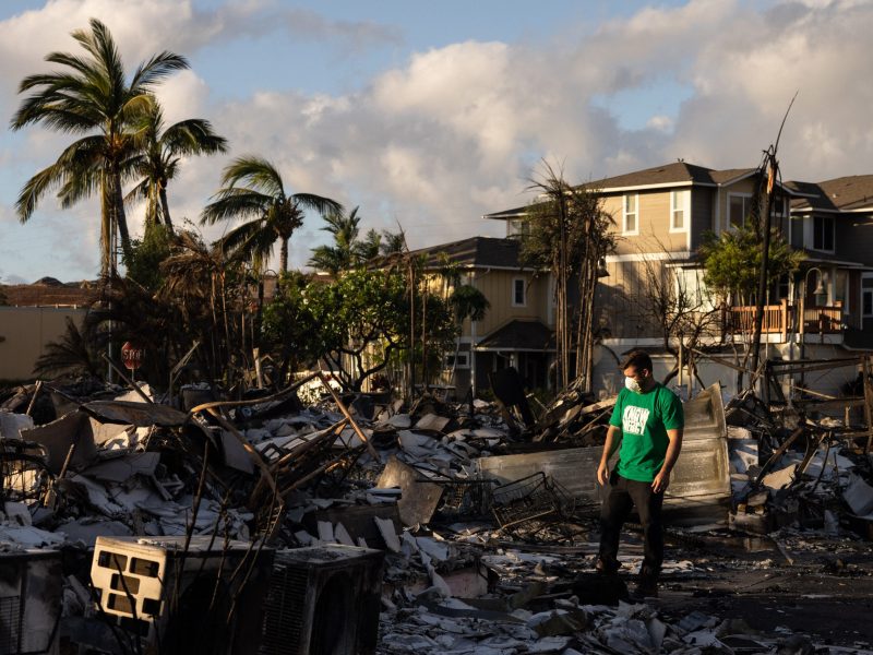 A Mercy Worldwide volunteer makes damage assessment of charred apartment complex in the aftermath of a wildfire in Lahaina, western Maui, Hawaii on August 12, 2023. Photo by YUKI IWAMURA/AFP via Getty Images