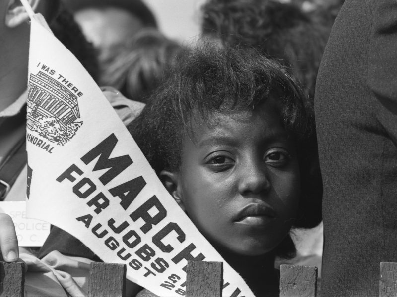 Close-up of Edith Lee Payne of Detroit, a young marcher participating in the March for Jobs and Freedom to the Lincoln Memorial in Washington DC, August 28, 1963. Photo by Rowland Scherman/Getty Images