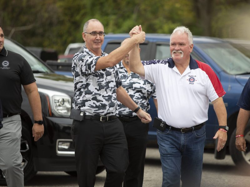 United Auto Workers President Shawn Fain greets UAW members as they strike the General Motors Lansing Delta Assembly Plant on Sept. 29, 2023, in Lansing, Michigan.