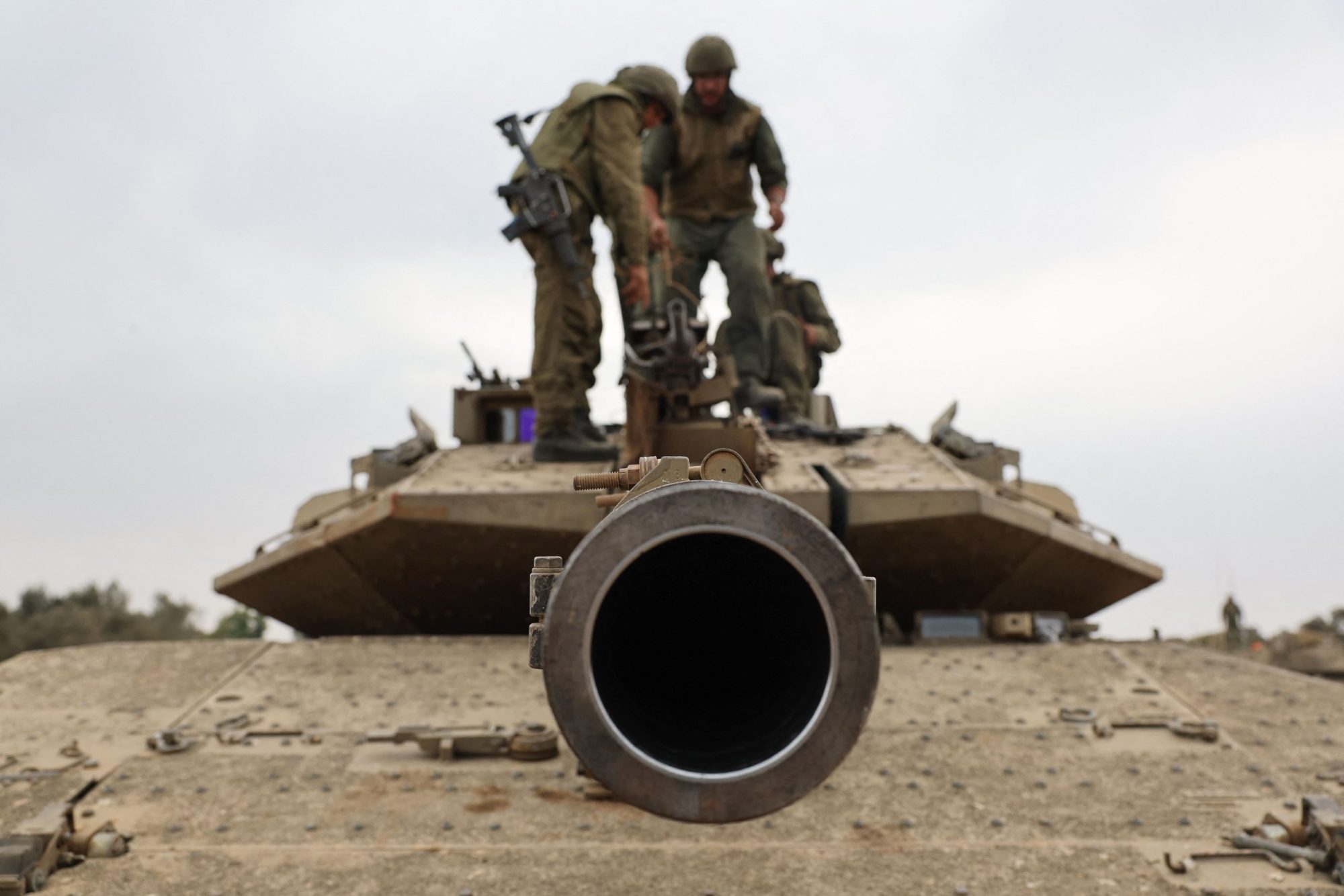 Israeli army soldiers are positioned with their Merkava tanks near the border with the Gaza Strip in southern Israel on October 9, 2023.Photo by JACK GUEZ/AFP via Getty Images