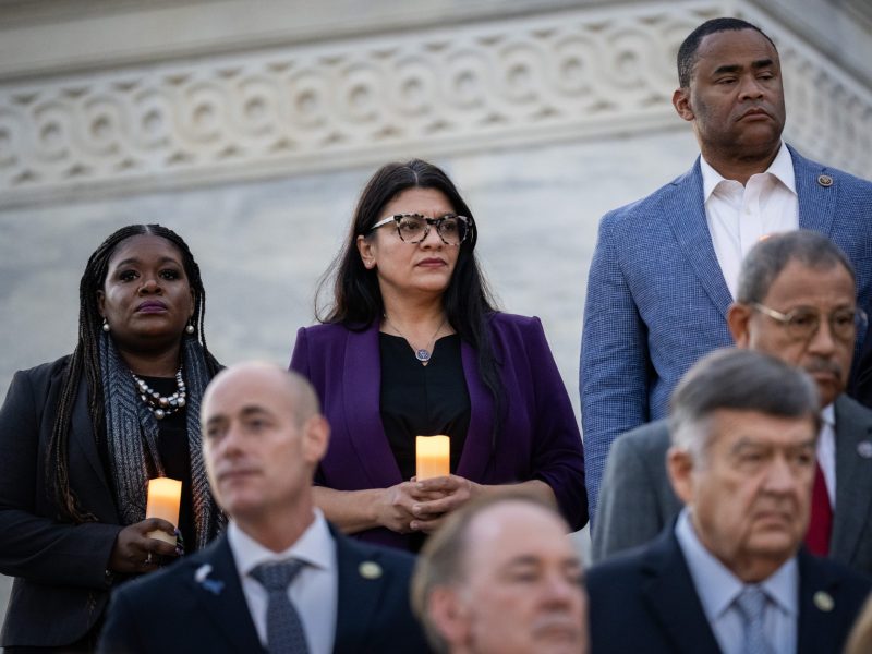 At left, Rep. Cori Bush (D-MO) and Rep. Rashida Tlaib (D-MI) attend talk with each other as they attend a bipartisan candlelight vigil with members of Congress to commemorate one month since the Hamas terrorist attacks in Israel on October 7, at the U.S. Capitol November 7, 2023 in Washington, DC. Photo by Drew Angerer/Getty Images