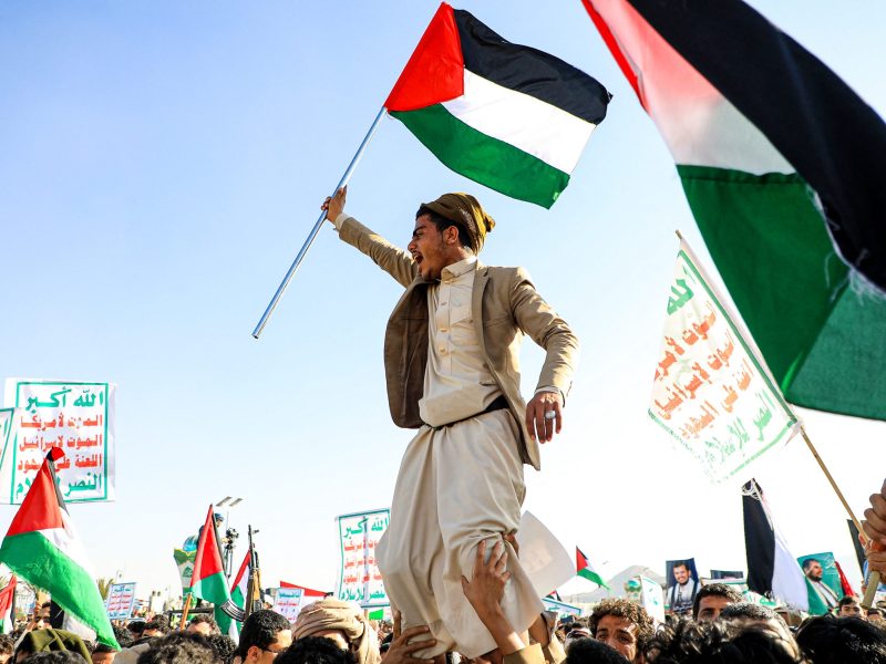 Yemenis wave Palestinian flags during a march in solidarity with the people of Gaza in the Huthi-controlled capital Sanaa on December 22, 2023. Photo by MOHAMMED HUWAIS/AFP via Getty Images