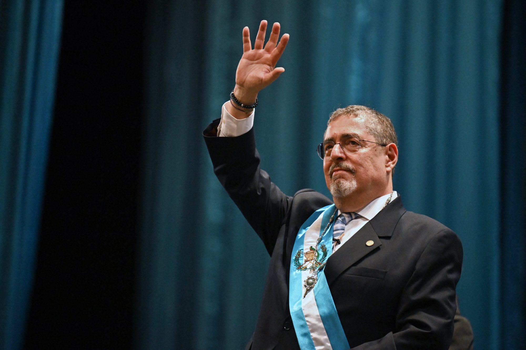Guatemala's new President Bernardo Arevalo waves after swearing in during his inauguration ceremony at the Miguel Angel Asturias Cultural Centre in Guatemala City, early on January 15, 2024. Photo by JOHAN ORDONEZ/AFP via Getty Images