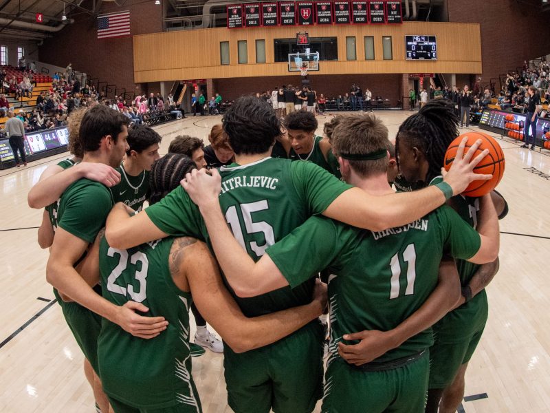 Dartmouth Big Green players huddle as a team before the college basketball game between the Dartmouth Big Green and the Harvard Crimson on February 10, 2024, at Lavietes Pavilion in Allston, MA. Photo by Erica Denhoff/Icon Sportswire via Getty Images