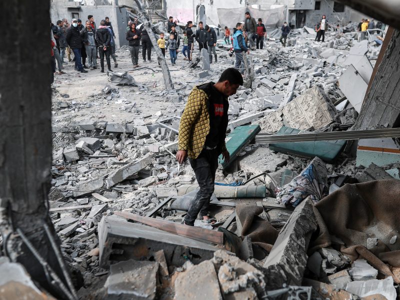 Palestinians, including children, collect usable belongings in the heavily damaged buildings after Israeli attacks in Rafah, Gaza on February 12, 2024. Photo by Jehad Alshrafi/Anadolu via Getty Images