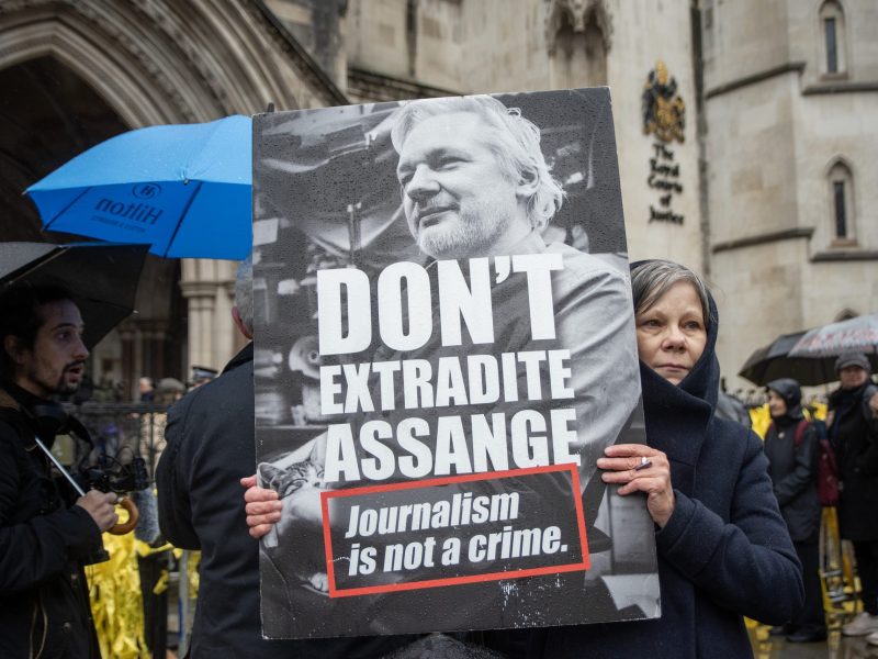 A protester holds a placard outside the Royal Court of Justice during the demonstration. Hundreds of protesters gathered on the second day of Julian Assange's trial in front of the Royal Court of Justice in London, UK. Photo by Krisztian Elek/SOPA Images/LightRocket via Getty Images