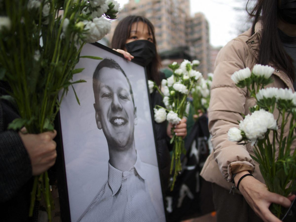 Demonstrators from the Taiwan Action Front for Palestine display a portrait of Aaron Bushnell, a 25-year-old active duty member of the US Air Force who setting himself on fire outside the Israel Embassy in Washington, during a protest against US's policies to Israel and Palestine, outside the American Institute in Taiwan (AIT) in Taipei on March 7, 2024. (Photo by SAM YEH/AFP via Getty Images)