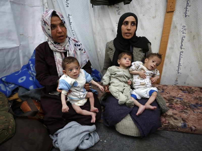 Baby triplets of Palestinian mother Nuzha Awad face the threat of dying from malnutrition and lack of medical care due to constant Israeli attacks and blockades as they take shelter in Nuseirat camp in Deir al Balah, Gaza, on March 25, 2024.
