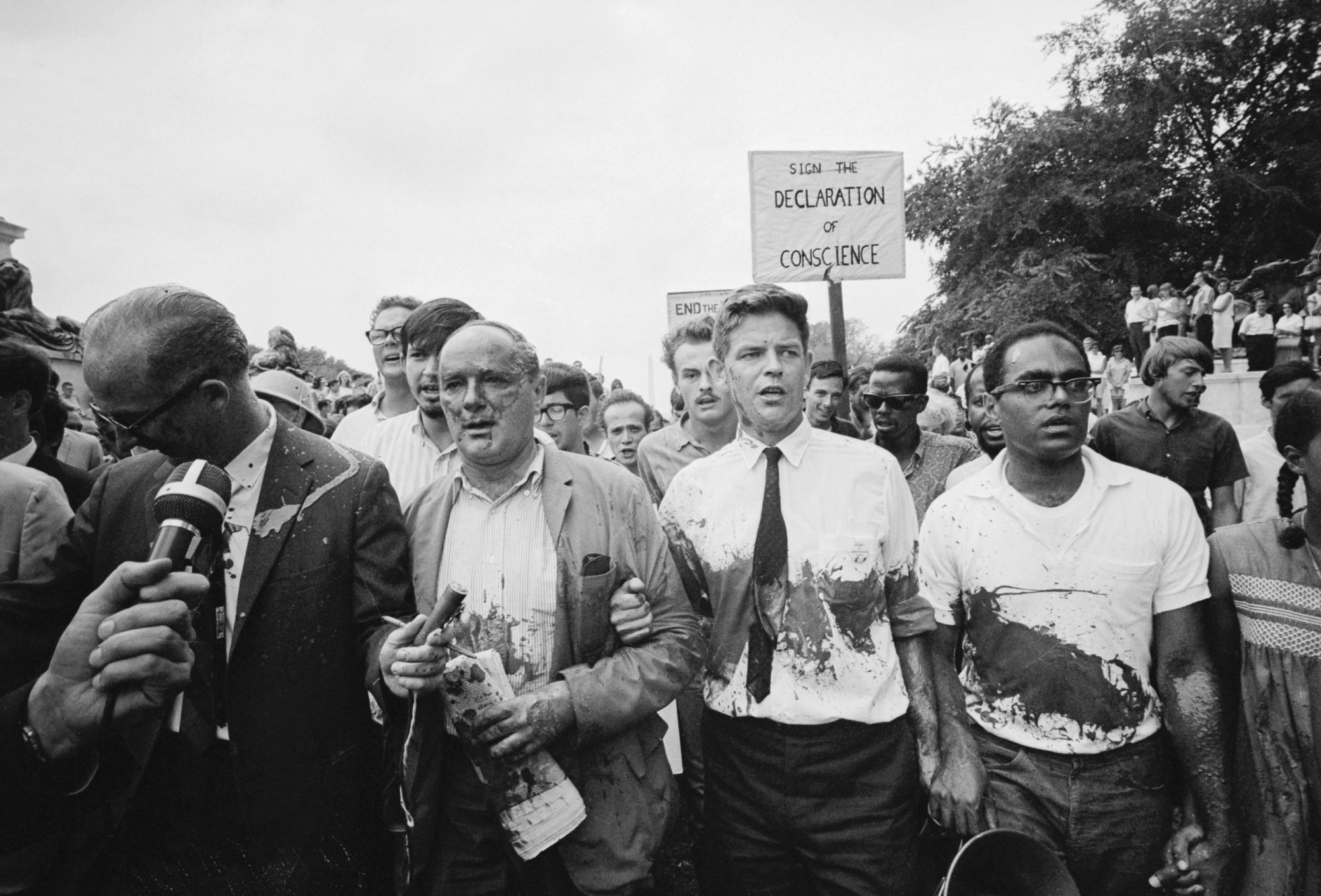 Professor Staughton Lynd. an outspoken critic of U.S. policy in Vietnam, was reported to be in Hanoi 12/28 to gather information regarding North Vietnam's peace conditions. LYnd, shown here in a 1965 file photo after he was splashed with red paint on a peace March in Washington, teaches history at Yale university and is one of the leaders of the Anti-war movement.