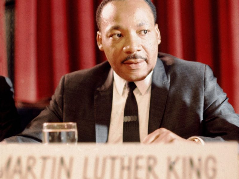 Dr. Martin Luther King Jr. sits at a table during The Nation Institute California Conference circa 1967 in Los Angeles, California. Photo by Martin Mills/Getty Images