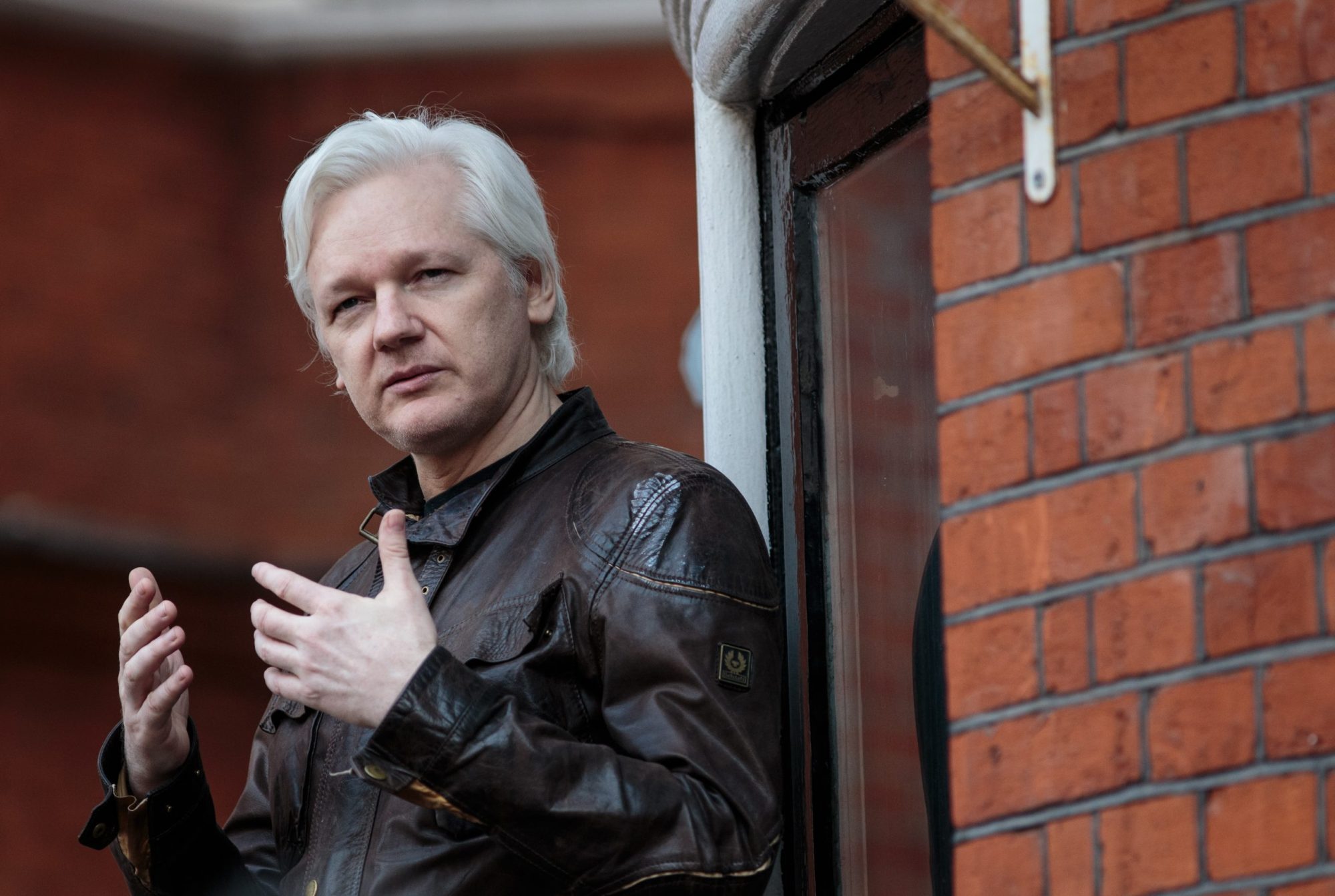 Julian Assange speaks to the media from the balcony of the Embassy Of Ecuador on May 19, 2017 in London, England. Photo by Jack Taylor/Getty Images