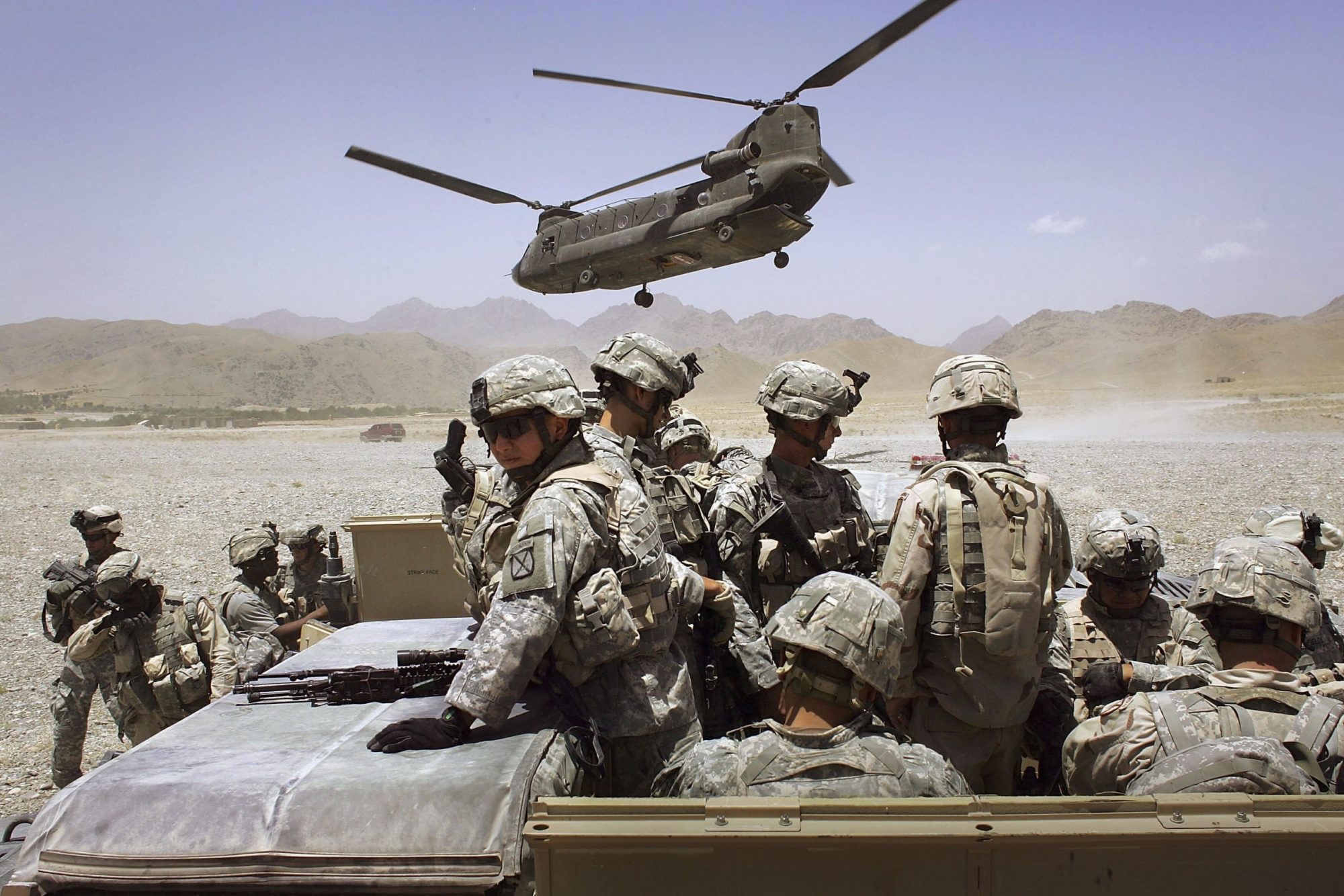 American soldiers from the 10th Mountain Division deploy to fight Taliban fighters as part of Operation Mountain Thrust to a U.S. base near the village of Deh Afghan on June 22, 2006 in the Zabul province of Afghanistan. Photo by John Moore/Getty Images