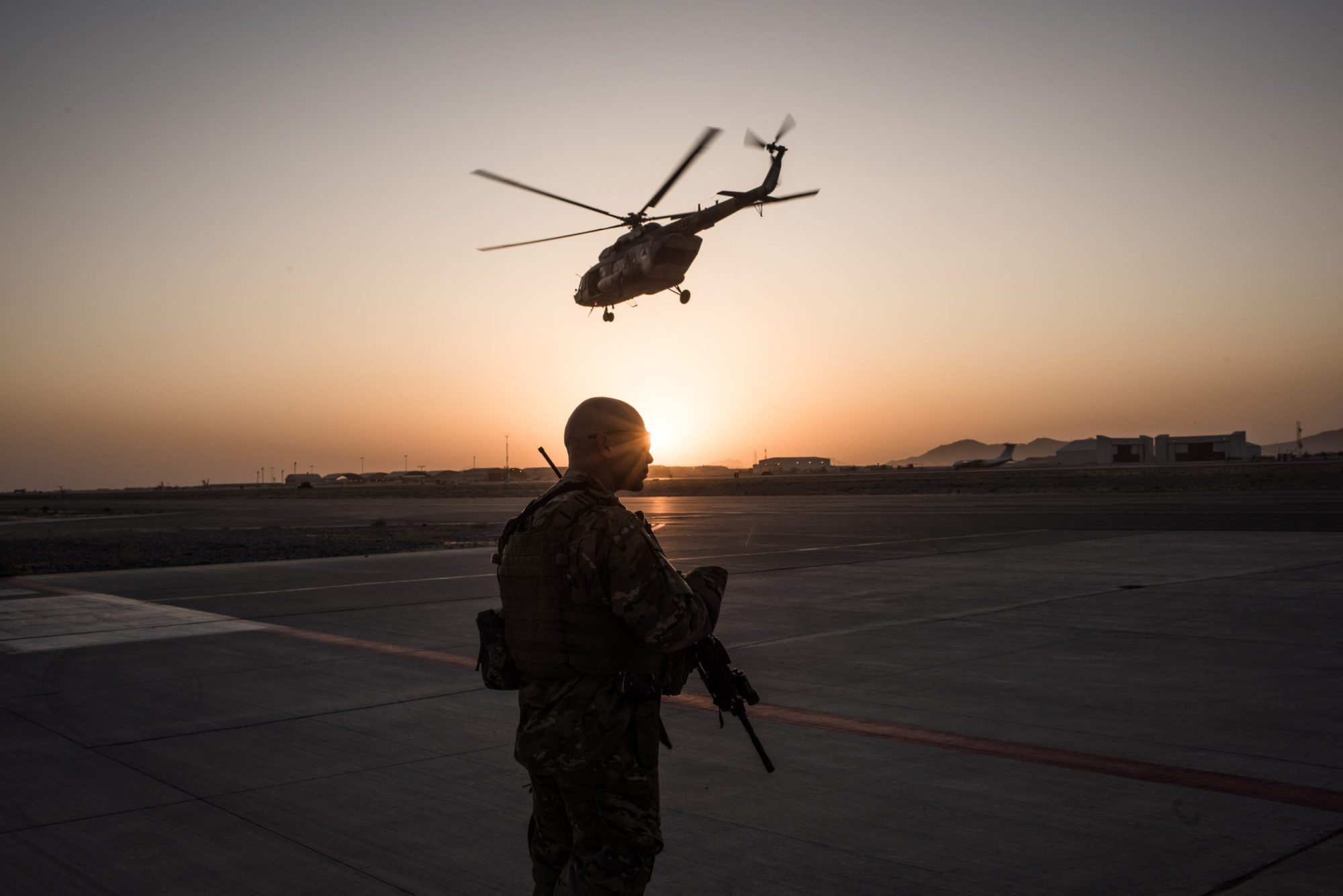 A member of the United States Air Force keeps watch over the runway on Sept. 9, 2017, at Kandahar Air Field in Kandahar, Afghanistan.