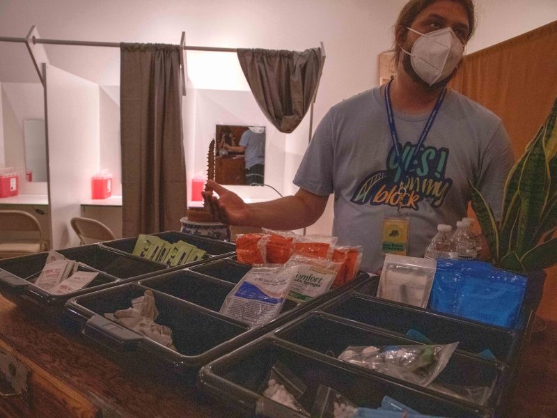 ﻿﻿A harm reductionist provides a tour of a mock overdose prevention site.